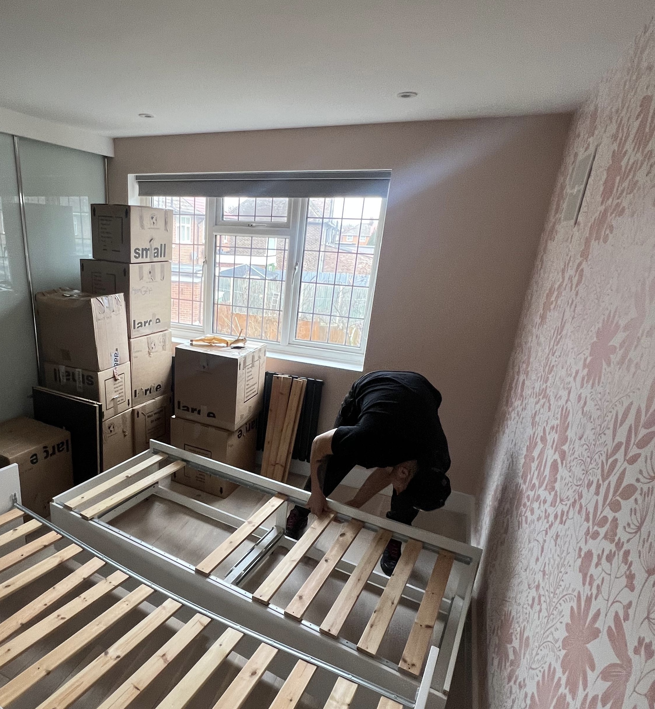 Bed reassembly during a house move in Wimbledon