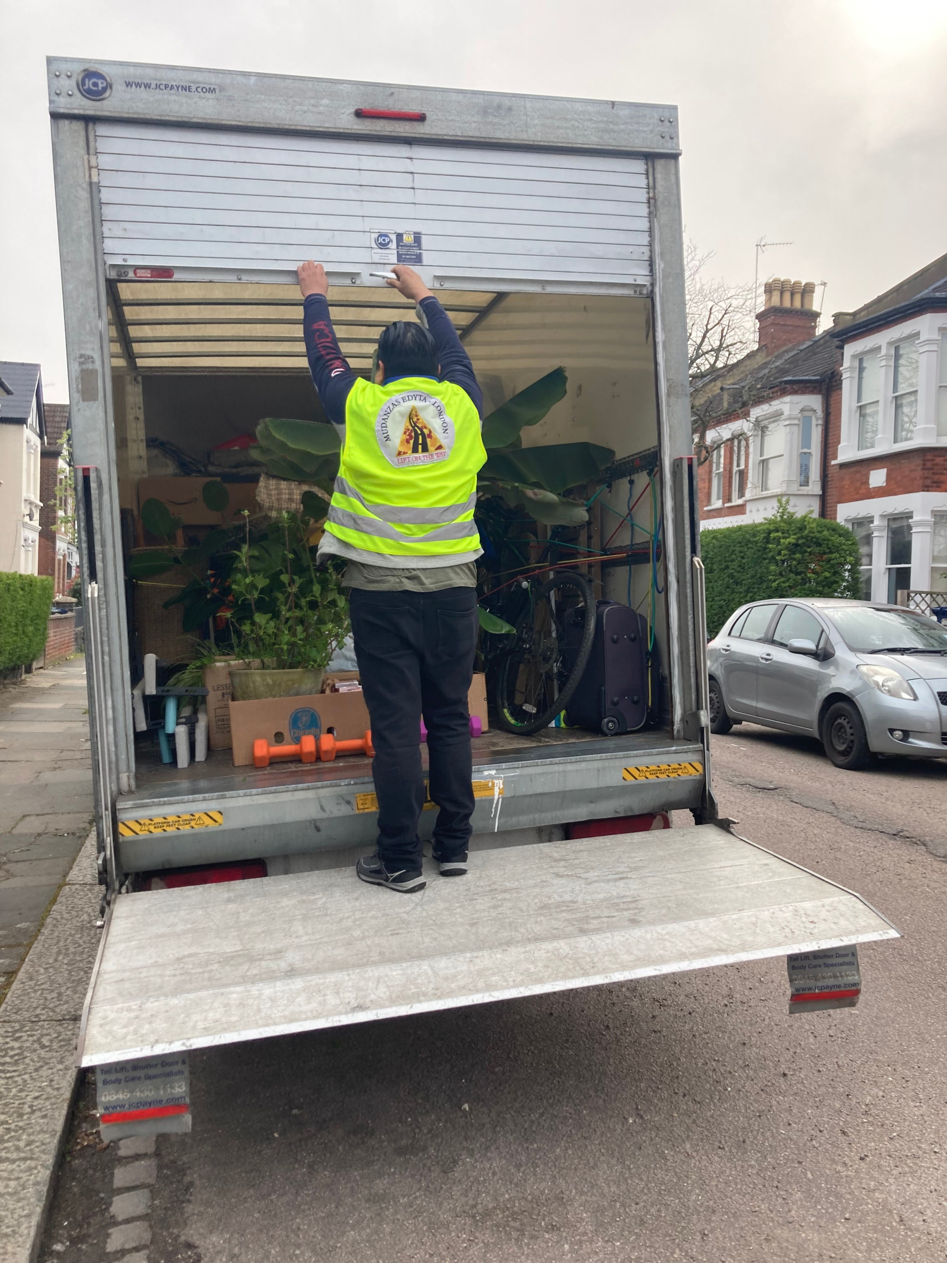 Luton removals van on a residential street in Wimbledon SW19
