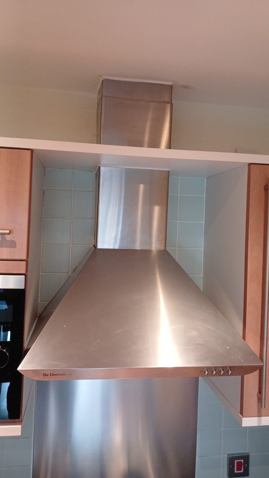 Freshly cleaned stainless steel kitchen extractor as part of an end of tenancy cleaning in London